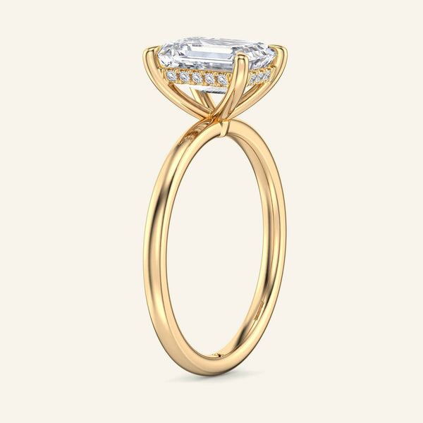 Side view of Aura Emerald Hidden Halo Solitaire Lab Grown Diamond Ring in yellow gold, showcasing hidden halo detail.