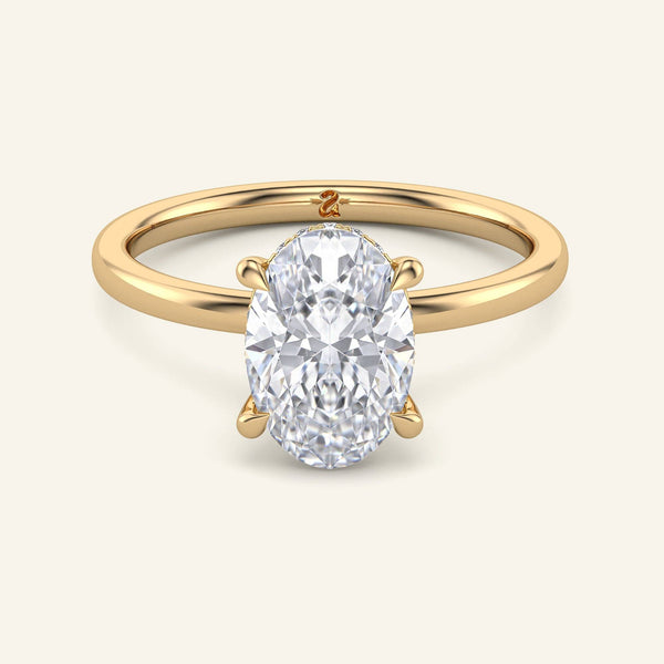 Aura Oval Hidden Halo Lab Diamond Ring | 3 Carat in yellow gold with a solitaire oval cut lab-grown diamond and delicate hidden halo setting.