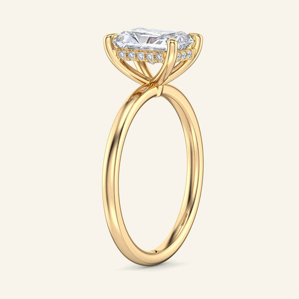 Side view of 2 Carat Aura Radiant Hidden Halo Solitaire Diamond Ring in yellow gold showcasing hidden halo and elevated solitaire setting.