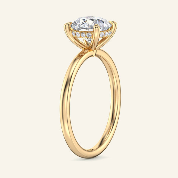 Side view of Aura Round Hidden Halo Solitaire Lab Diamond Ring in yellow gold showcasing elevated prong setting and hidden halo detail.