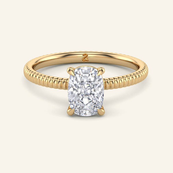 Bianca Elongated Cushion Ribbed Band Solitaire Diamond Ring in yellow gold with a 2 carat lab grown diamond and detailed ribbed band design.