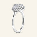 Side profile of Celeste Oval Three Stone Diamond Engagement Ring in white gold, emphasizing the elegant prong setting and oval diamond trio.