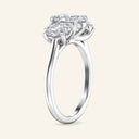 Side profile of Celeste Oval Three Stone Diamond Engagement Ring in white gold, emphasizing the elegant prong setting and oval diamond trio.