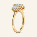 Side view of Celeste Oval Three Stone Diamond Engagement Ring in yellow gold, highlighting the raised prong setting and oval diamonds.