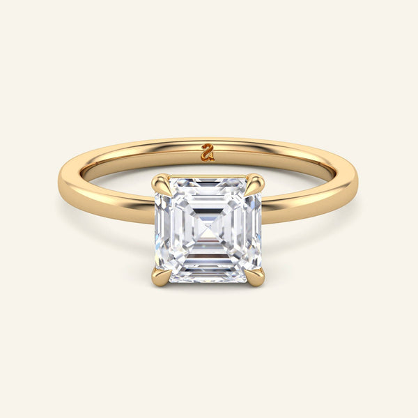 June Asscher Classic Solitaire Diamond Ring in yellow gold with a 2 carat asscher cut lab grown diamond, featuring a timeless four-prong setting.