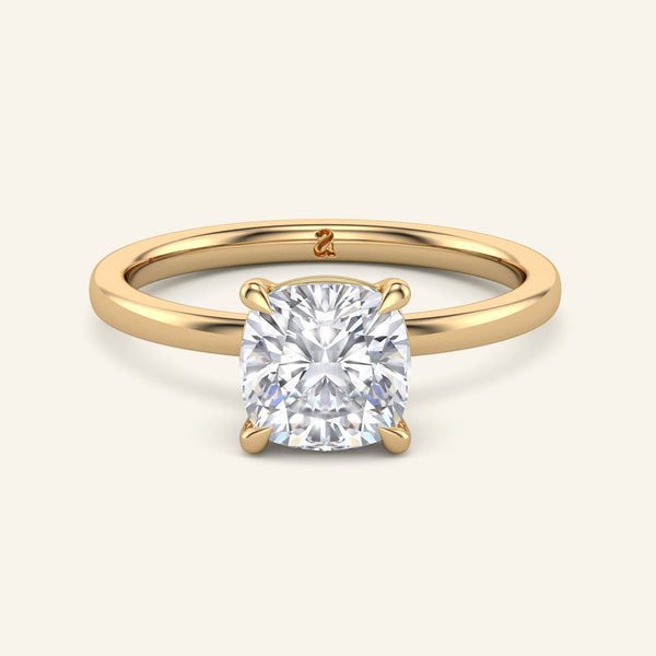 June Cushion Classic Solitaire Diamond Ring in yellow gold with a 2 carat lab grown cushion cut diamond and secure prong setting.