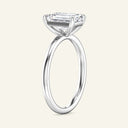 Profile view of June Emerald Classic Solitaire Lab Grown Diamond Ring in white gold, emphasizing the elevated emerald-cut diamond and slim band.