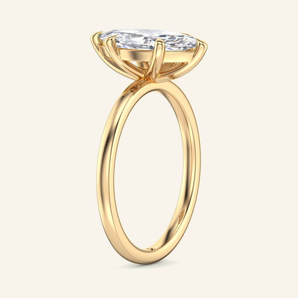 Side view of June Marquise Classic Solitaire Diamond Ring | 2 Carat in yellow gold showing elevated marquise diamond and sleek band profile.