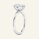 Side profile of June Oval Classic Solitaire Diamond Ring in white gold, emphasizing the elevated oval diamond and minimalist band structure.