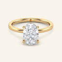 June Oval Classic Solitaire Diamond Ring in yellow gold with a 2 carat lab grown oval diamond, featuring a secure four-prong setting and polished band.