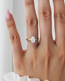 2 Carat June Oval Classic Solitaire Diamond Ring worn on hand, showcasing its elegant yellow gold band and sparkling oval cut lab grown diamond.