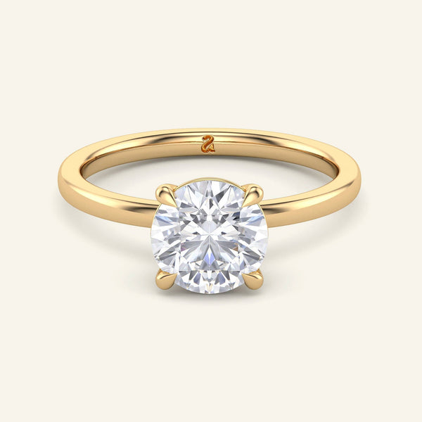 June Round Classic Solitaire Diamond Ring in yellow gold with a 2 carat lab grown round diamond, featuring a secure four-prong setting.