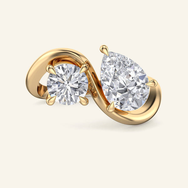 Nectar Round Pear Floating Toi et Moi Lab Grown Diamond Ring in yellow gold with 2 carat round and pear-shaped diamonds on a twisted band.
