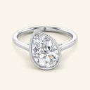 Remi Pear Bezel Solitaire Diamond Ring in white gold featuring a 2 carat tilted pear-shaped lab-grown diamond, bezel-set for a unique engagement style.