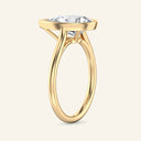 Side view of Remi Pear Bezel Solitaire Diamond Ring in yellow gold, showcasing the elevated 2 carat pear-shaped diamond in a sleek bezel setting.