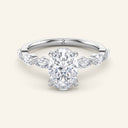 Vera Oval Half-Coverage Solitaire Diamond Ring in white gold featuring 2 carat lab-grown oval diamond and half-band marquise accents.
