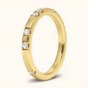 Side view of Noah 2.4mm Lab Diamond Ring in yellow gold showcasing sparkling lab-grown diamonds and sleek band design for refined elegance.