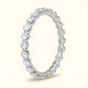 Angled view of Juniper Eternity Lab Diamond Ring in white gold, highlighting the elegant floating prong setting and full diamond circle.