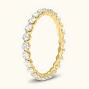 Side view of Juniper Eternity Lab-Grown Diamond Ring in yellow gold, showcasing floating prong-set diamonds in a continuous band.