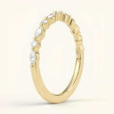 Side view of Lira Lab Diamond Eternity Band in yellow gold showing the elegant 1.5mm marquise and round diamond arrangement for a modern stackable look.