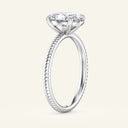 Profile view of Bianca Oval Ribbed Band Solitaire Diamond Ring in white gold highlighting the raised oval diamond and fine ribbed detailing.