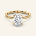 Bianca Oval Ribbed Band Solitaire Diamond Ring in yellow gold with a 2 carat lab-grown oval diamond and detailed ribbed band design.