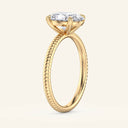 Side view of Bianca Oval Ribbed Band Solitaire Diamond Ring in yellow gold showcasing the elevated 2 carat oval diamond and ribbed band texture.