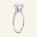Profile view of white gold Cora Cushion Cathedral Pavé Solitaire Diamond Ring with raised cushion-cut diamond and pavé detailing on the band.