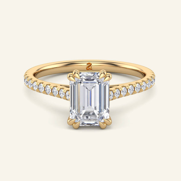 Cora Emerald Cathedral Pavé Solitaire Diamond Ring in yellow gold with a 2 carat emerald-cut lab grown diamond and pavé band setting.