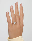 2 carat Cora Cushion Cathedral Pavé Solitaire Diamond Ring on hand, showcasing elegant yellow gold setting and sparkling cushion-cut center stone.