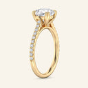 Side view of Cora Cushion Cathedral Pavé Solitaire Diamond Ring in yellow gold, highlighting cathedral arches and pavé diamond band.