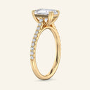 Side view of Cora Emerald Cathedral Pavé Solitaire Diamond Ring in yellow gold, highlighting cathedral arches and pavé diamond detailing.