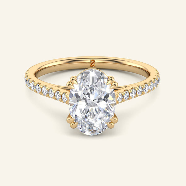 Cora Oval Cathedral Pavé Solitaire Diamond Ring in yellow gold with 2 carat lab grown oval diamond and pavé band, perfect for engagement.