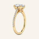 Side view of Cora Oval Cathedral Pavé Solitaire Diamond Ring in yellow gold, highlighting cathedral arches and pavé diamond band.