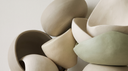 Putty and sage curved forms in soft daylight — abstract editorial backdrop for lab-grown diamond bracelets