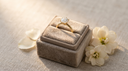 One carat round brilliant lab-grown diamond solitaire engagement ring in solid gold in a greige velvet ring box