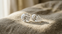 Two diamond gemstones resting side by side on warm linen, symbolising a diamond toi et moi ring