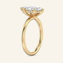 Side view of yellow gold Aura Marquise Hidden Halo Solitaire Diamond Ring showcasing hidden halo detail and slim band for elegant bridal wear.