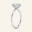 Profile view of 3 Carat Aura Oval Hidden Halo Lab Diamond Ring in white gold, highlighting the hidden halo under the elevated oval diamond.