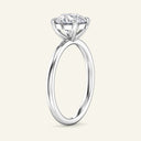 Profile view of June Round Classic Solitaire Diamond Ring in white gold, emphasizing the raised solitaire setting and sleek band silhouette.