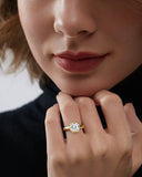 Model wearing the Terra Asscher Heavy Bezel Diamond Ring showcasing the 2 carat asscher-cut diamond in a chunky yellow gold bezel setting.
