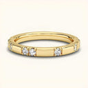 Noah 2.4mm Lab Diamond Ring in yellow gold with round diamonds in a scalloped pavé setting. Elegant jewelry ideal for stacking or wedding wear.