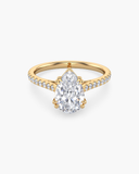 Cora pear-cut lab-grown diamond cathedral pave solitaire ring in solid gold, front view