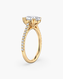 Cora pear-cut lab-grown diamond solitaire ring, side view showing cathedral setting and pave band