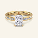 Vesper Radiant Baguette Channel-Set Diamond Ring in yellow gold with 2 carat radiant cut center and baguette side stones, vintage-inspired band.
