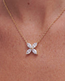 Model wearing Alya Stone Margot Marquise X diamond necklace in solid gold