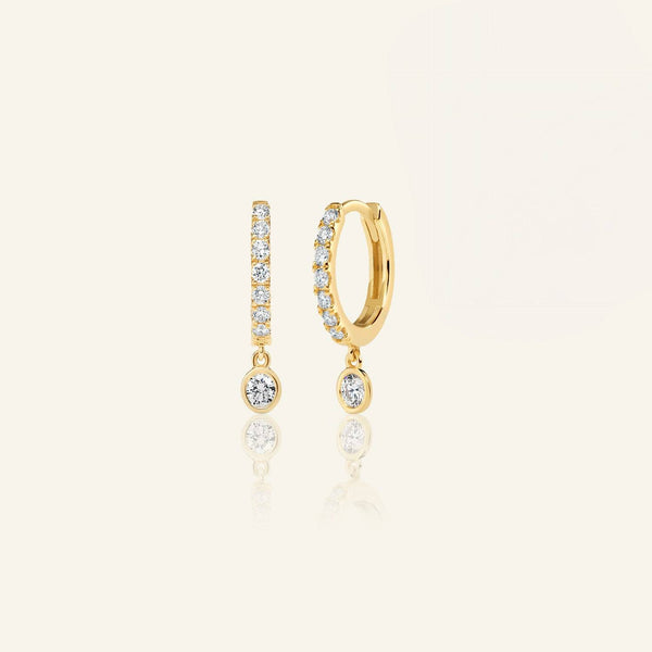 Lab grown diamond drop huggie earrings in 10K yellow gold with round-cut diamonds. Elegant and affordable jewelry for everyday wear.
